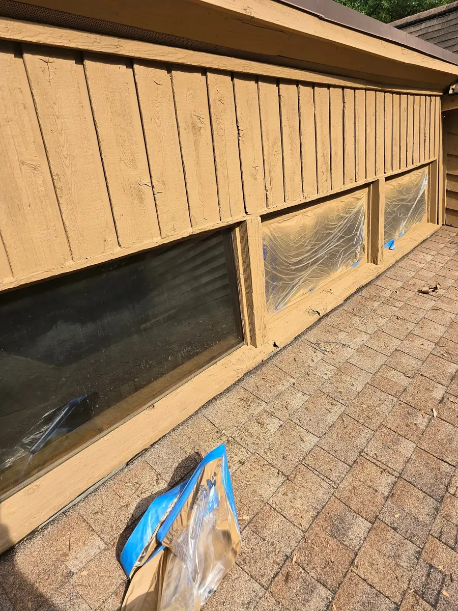 Freshly painted exterior trim and siding after work
